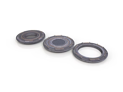 Three Black Circular Mechanical Components With Central Holes And Raised Edges 3d model