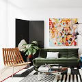 Modern Living and Dining Area Interior With Green Sofa Colorful Paintings Dining Table And Plants