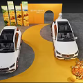 Automotive Exhibition Display With White Cars Orange Backdrop And Decorative Fruits