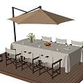 Outdoor Table with Beige Umbrella White Tablecloth Flower Vase and Chairs on Wooden Deck