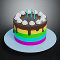 Colorful Rainbow Cake With Chocolate Drizzle White Cream Decorations And Blue Candles On White Plate
