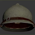 Vintage Metal Helmet With Worn Surface And Red Leather Strap Buckle