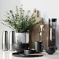 Elegant Modern Tableware Set With Stainless Steel Containers Black Mugs And Eucalyptus Greenery