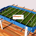 Blue Foosball Table With Green Grass Surface And Player Rods On Wooden Floor