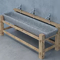 Textured Concrete Hand Basin with Wooden Stand and Two Taps Against Grey Wall