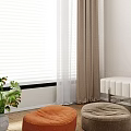 Two Round Orange And Gray Bean Bag Chairs On Wooden Floor In Living Room