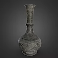 Antique Carved Metal Vase With Intricate Floral Patterns And Ornate Design