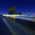 Night View Of Landscape Bridge With Colorful Lights Street Lamps And Tall Buildings