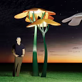 Orange Flower Shaped Structures On Green Grass With Blue Sky White Clouds And Man 3d model