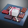 Assorted Chocolate Pieces Arranged With White Gift Box On Blue Tray 3d model