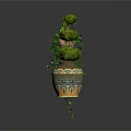 Hanging Vine Plant With Green Leaves And Three Tiered Spherical Topiary In Patterned Ceramic Pot