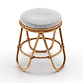Sturdy Rattan Stool with Round Gray Padded Seat and Handwoven Frame Design