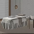Comfortable Massage Bed With White Sheets Towels And Candles On Side Table In Spa Room