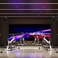 Modern Fitness Gym With Spin Bikes Large Screen And Purple Blue Lighting