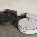 Smart Robot Vacuum Cleaners With Black White Design And Charging Dock On Wooden Floor