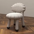 Crocheted Kids Chair Featuring Scalloped Backrest Padded Seat And Black Foot Caps On Wooden Floor