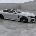 White BMW Sports Coupe in Modern Interior Space with Sleek Concrete Floor and Grid Ceiling