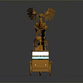 Intricate Orange Mechanical Sculpture With Phoenix And Human Figure On Wheel Platform