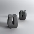 Two Black Wooden Stools With Unique Wood Grain And Modern Design In Minimalist Setting