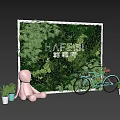 Green Plant Wall with Pink Rabbit Doll Light Blue Bicycle and Small Potted Plants