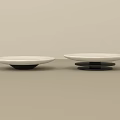 Two White Ceramic Dishes With Black Bases On Light Surface Minimalist Design
