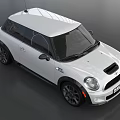 White Sporty Compact Car With Black Accents Alloy Wheels And Front Grille