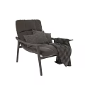 Comfortable Brown Leather Leisure Chair With Soft Pillows And Plaid Blanket