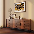 Cozy Room Corner With Wooden Dresser Decorative Items And Wall Art