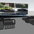 Black Outdoor Sofa Set In Modern Patio With Lush Greenery And Water Feature