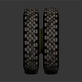 Off Road Tire With Green Wheel Rim Deep Tread Pattern And Heavy Duty Construction Design