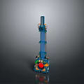 Blue Mechanical Toy Model Tower Featuring Red Circular Component And Green Yellow Details