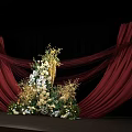 Elegant Banquet Hall with Red Curtains Stage Flower Arrangements Candles and White Chairs