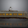 Model Train with Silver Body Pantograph Orange Lit Windows and Reflection on Gray Background