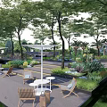 Outdoor Landscape Seats Surrounded by Trees and Green Plants in Garden Area with Tables
