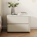 Modern White Bedside Table with Transparent Vase White Flowers Books and Eyeglasses