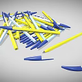 Pile of Blue Yellow and White Ballpoint Pens Scattered on Gray Background