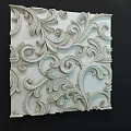Elegant White Wall With Intricate 3D Relief Floral Scroll Patterns And Carved Details