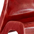 Modern Red Leisure Chair With Sleek Lines Glossy Surface And Unique One Piece Design
