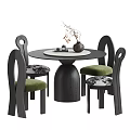 Modern Black Round Wooden Table and Chairs Set with Green Patterned Seats and Decorative Vase
