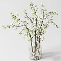 Decorative Transparent Vase Holding White Small Flowers And Green Leafy Branches