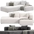 Stylish Gray and White Sectional Sofa with Soft Pillows and Cozy Throw Blanket