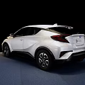 White Modern Car With Sleek Exterior Design And Alloy Wheels On Display Platform