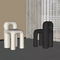 Modern Single Chair Design In White And Black With Round Hole For Minimalist Interior