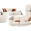 Modern Cream Curved Sectional Sofa With Brown Gray Pillows And Blanket