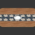 Oval Shaped Wooden Dining Table With Blue And White Patterned Tablecloth And Decorative Bowl