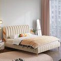 Double Bed With Beige Upholstered Headboard Plush Toys Orange Blanket Nightstand Mirror And Window Curtains