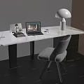 Elegant Modern Desk With Marble Top Laptop Books Photo Frame And Comfortable Gray Chair