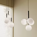 Multiple White Spherical Chandeliers with Black Rods in Interior Near Window