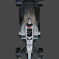 Silver And Green Formula 1 Racing Car With PETRONAS Logo And Streamlined Body Design