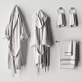 White Bathrobes and Towels Set Hanging on Bathroom Wall for Cozy Home Use